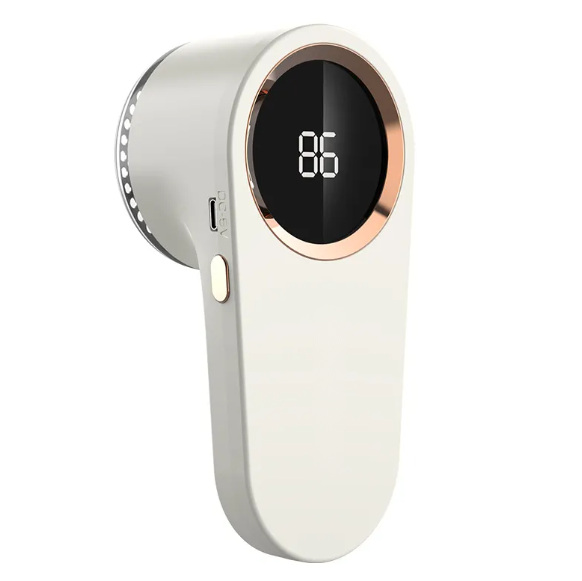 Rechargeable fabric shaver for removing lint and fuzz from clothing